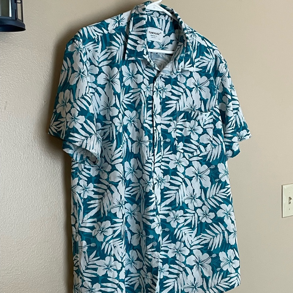 Turquoise and white floral pattern dress shirt. Soft feel fabric only worn once.